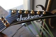 JACKSON MJ Series Rhoads RR24MG, Black with Yellow Pinstripes, Ebony Fingerboard, SOFTCASE